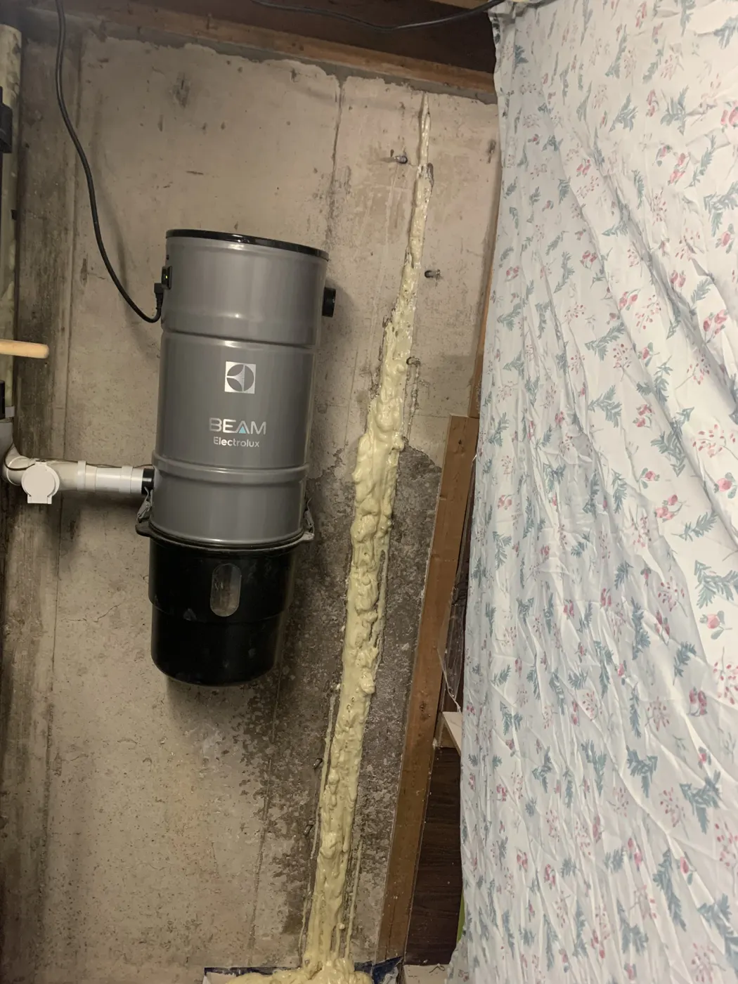 Hydrophobic polyurethane foam expanding out of a full-height foundation crack during injection in a Mississauga basement
